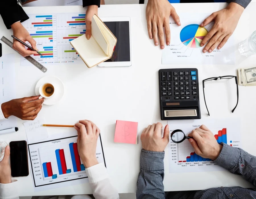 businessmen-hands-white-table-with-documents-drafts